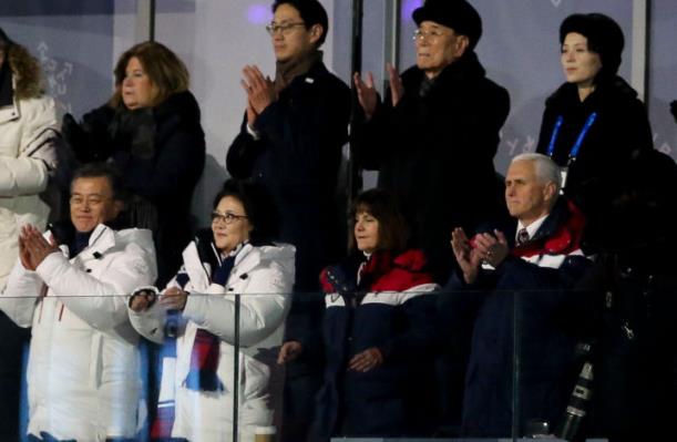 South Korean President Moon Jae-in, left, stands with his wife Kim Jung-sook, and Karen and Mike Pence during the Opening Ceremony of the Pyeongchang Winter Olympic Games. Standing above them, at right, are Kim Yo-jong, sister of North Korean leader Kim Jong-un, and North Korean delegation leader Kim Yong-nam. ©Jean Catuffe/Getty Images